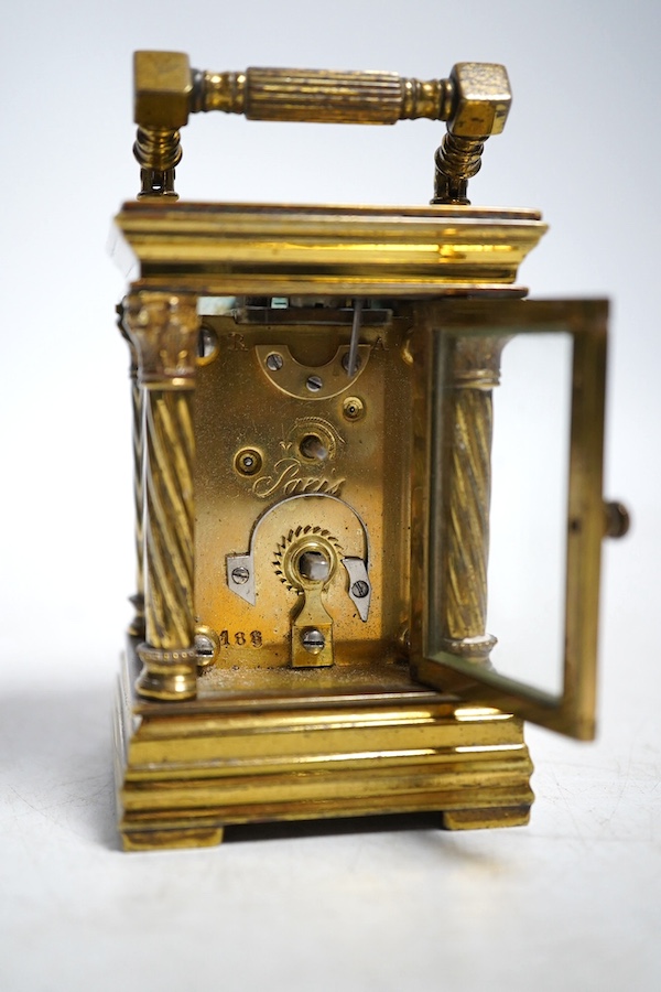 A miniature carriage timepiece, with four ornate corner columns, turquoise dial and gilt filigree mount, 8cm high. Condition - fair, not tested as working